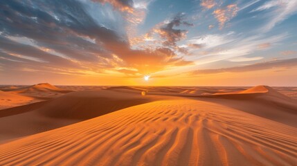 Fototapeta na wymiar As the day comes to a close the desert transforms into a mirage of endless golden sands while the setting sun adds a touch of magic . .