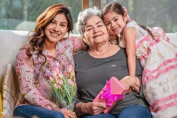 Grandmother, mother and daughter, three generations of Latina women.