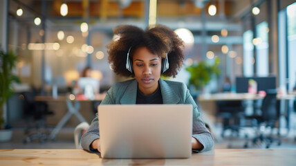 Businesswoman Working on Laptop with Headphones