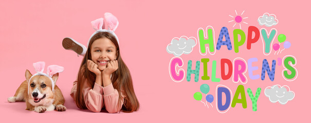 Little girl with cute Corgi dog in bunny ears lying on pink background