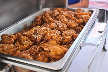 Closeup of fried chicken with sesame seeds.