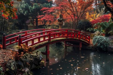Autumnal red bridge over a tranquil pond - Lush autumn scene featuring a curved red bridge over a peaceful pond surrounded by vibrant foliage