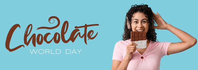 Beautiful young African-American woman in headphones with sweet chocolate bar on blue background