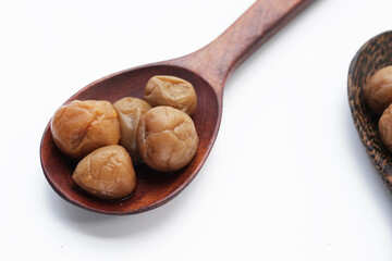 Pickled plums on white background.