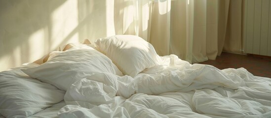 Fototapeta na wymiar A serene white bed is elegantly made up with a cozy white comforter and soft pillows