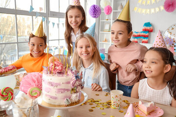 Cute little children with Birthday cake on table at party - obrazy, fototapety, plakaty