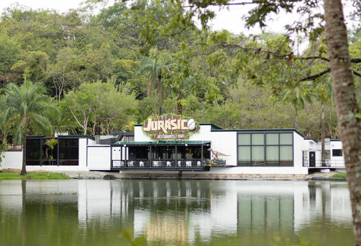 Restaurant and Bar &uml;Jurasico&uml; in the ecopark of the Cafam vacation center, Melgar in Tolima, Colombia. Dinosaur themed restaurant in front of a lake.