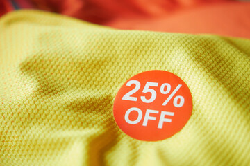 25 discount sakes tag on yellow color cloth 
