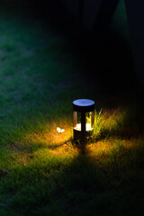 At night, a pale yellow light lights up in the middle of the grass. Viewed from a high place, the...