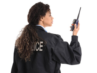 African-American female police officer with radio transmitter on white background