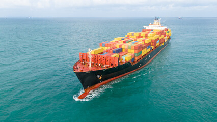 Cargo container ship carrying container and running out international container port customs...