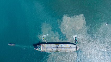 LPG ship, Oil tanker ship. Red Oil Tanker ranchored in Gas terminal gas tanks for storage....