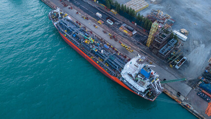 Oil tanker ship at dry dock concept maintenance service. working at dry dock. Insurance and...