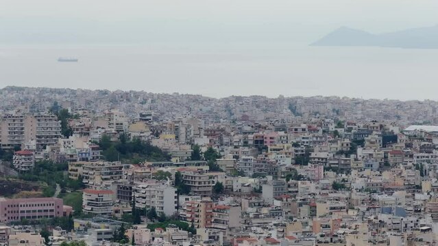 drone aerial footage of Athens , buildings and sea view