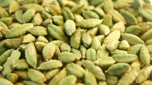  slow motion of Cardamom dropping on table 