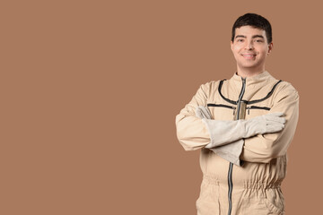 Male beekeeper on brown background