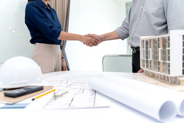 Architects or engineers hand shake to agree on the project
