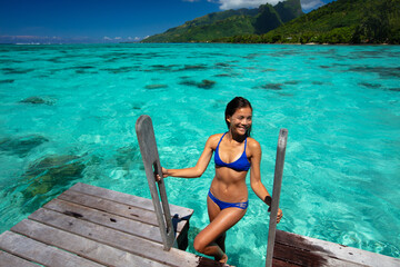 Island Bliss: Sunlight Dances on Crystal Waters as a Woman Savors Her Ocean Getaway Travel Vacation - 785867069
