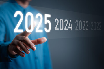 Happy New Year 2025, Hand touch on a virtual screen 2025, New Goals, Plans, and numbers for Next Year, Businessman touching future growth year 2024 to 2025, Planning, opportunity, business strategy