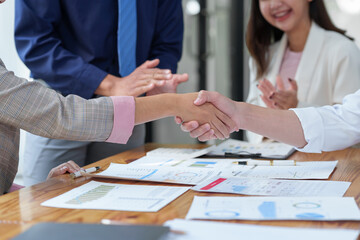 Business partners meeting concept Image of a businesswoman and man shaking hands Successful colleagues shake hands after doing a good deed.
