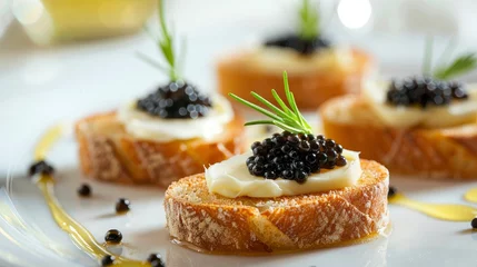 Foto op Plexiglas  little toasts with black caviar and butter against a white hazy backdrop © Image