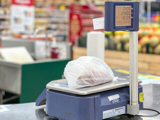 Weighing of Vegetable on Electronic Digital Scales in Supermarket.