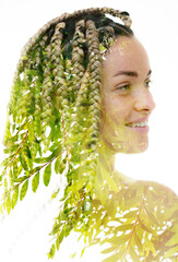 A double exposure portrait of a woman merged with a photo of green tree leaves.