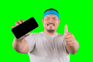 An Asian overweight man shows a finger on an isolated screen