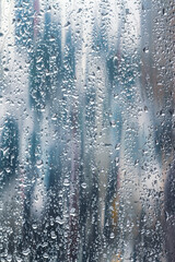raindrops on window glass. selective focus. closeup view. - 785887863