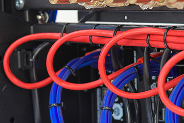 Plastic ties that tighten electrical wiring harnesses. Close-up.