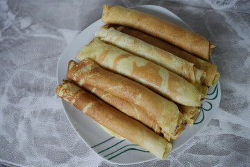Closeup of home pancakes on white background.