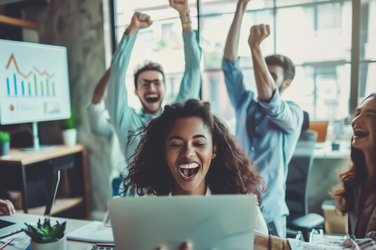 Joyful team celebrates a successful achievement in the office, with hands raised in victory. Employees celebrates their success, acheive target concept