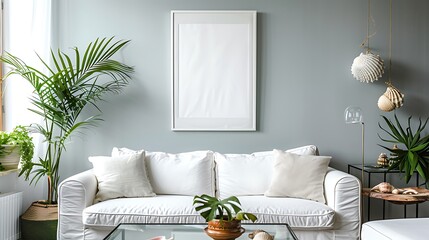 An elegant beach house living room with a large empty white frame dominating a soft blue wall.
