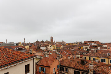 Obraz premium Red rooftop skyline and historic landmarks at cloudy wether in Venice, Italy