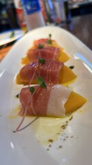 Prosciutto wrapped mango
