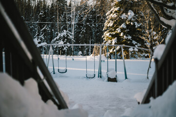 Thick snow covers a playground in Alaska, America.