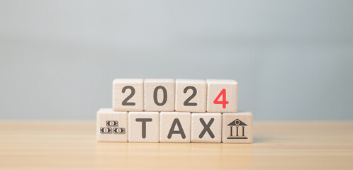 Wooden blocks with the word tax 2024 Business and finance concepts, taxes and taxes, taxation