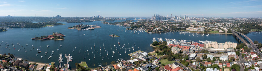 The Sydney suburb of Drummoyne, city skyline and Parramatta river .