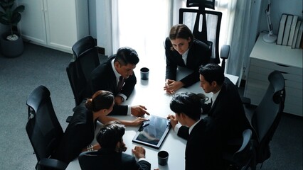 Top view of diverse business team discuss about marketing idea while businessman analyze financial...