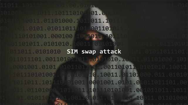 Sim swap attack text in foreground screen, anonymous hacker hidden with hoodie in the blurred background. Vulnerability text in binary system code on editor program.