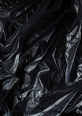 Obraz premium Wrinkled plastic wrap texture on a black background