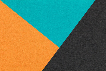 Texture of craft orange, turquoise and black shade color paper background, macro. Vintage cerulean...