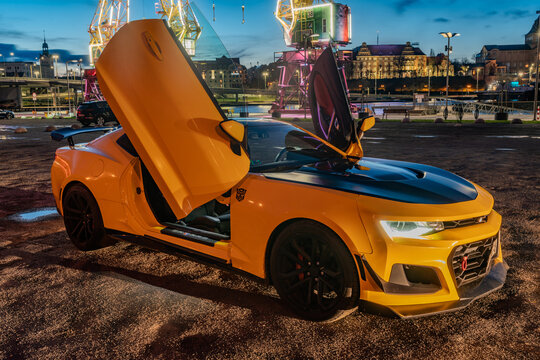 Chevrolet Camaro ZL1 with gullwing doors.Presentation against a background of beautiful illuminations