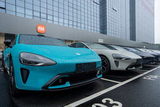 Shenzhen, Guangdong, China - Apr 8, 2024: Rows of Xiaomi's new Su7 electric cars are seen at its delivery and service center in Shenzhen, Guangdong Province, China.