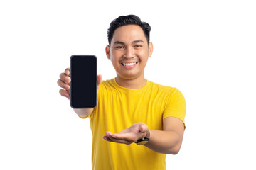 Happy young Asian man presenting smartphone screen with open hand gesture isolated on white background