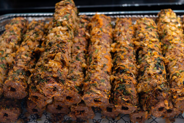 Lamb seekh kebabs meat food ready to cook on charcoal grill