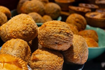 Traditional street food in UK, stuffed fried Scotch eggs with breadcrumbs close up
