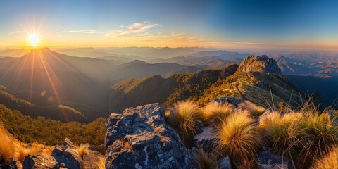 A beautiful mountain landscape with a large rock in the foreground