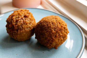 Traditional street food in UK, stuffed fried Scotch eggs with breadcrumbs close up