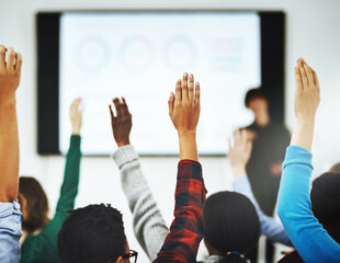 Lecture, hands and student with question, back and learners in university. Presentation, class and equation for group of people with query for teacher, scholar and learn on campus for education